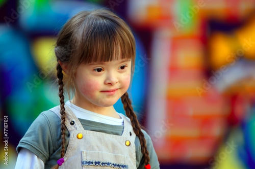 Fototapeta Portrait of beautiful young girl on the playground.