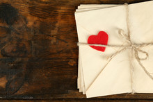 Stack Of Love Letters On Rustic Wooden Planks Background