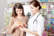 © DC Studio - Pharmacist showing product to client