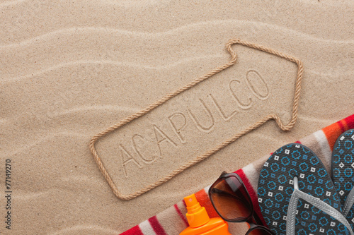 Fotografia, Obraz Acapulco pointer and beach accessories lying on the sand