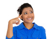 © pathdoc - Happy woman looking upwards with finger on temple daydreaming