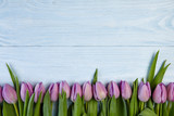 Fototapeta Tulipany -  Tulips on wood background