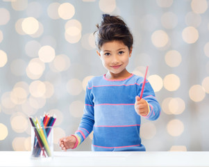 Sticker - happy little girl drawing with coloring pencils