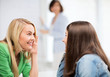 © Syda Productions - student girls gossiping at school