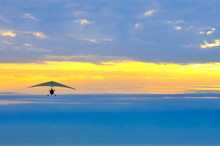 Motor Hang Glider In The Cloudy Sunset