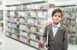 © wckiw - Little boy holding a book in the library
