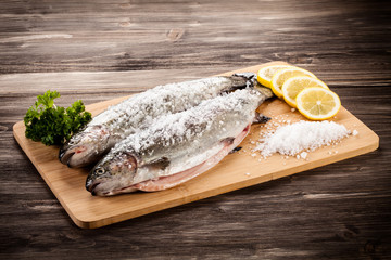 Fresh raw trouts on cutting board