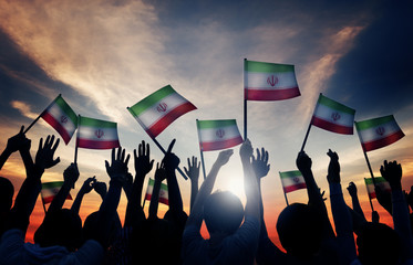 Wall Mural - Silhouettes People Waving Flag Iran Concept