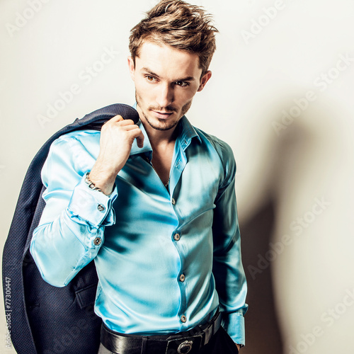 Naklejka - mata magnetyczna na lodówkę Elegant young handsome man in costume. Studio fashion portrait.