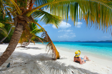 Wall Mural - Young woman relaxing at beach