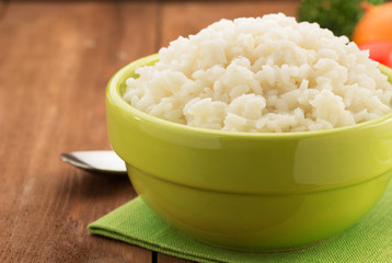 Sticker - bowl full of rice isolated on wood