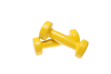 Pair of yellow dumbbells Isolated on white background