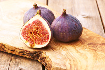 Wall Mural - Fresh figs on wooden table