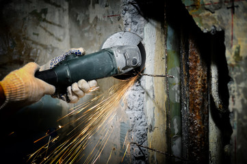 Wall Mural - Worker cutting metal with grinder