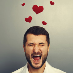 Poster - screaming man with red hearts