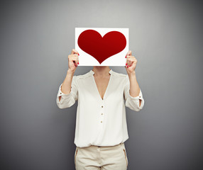 Poster - woman covering her face with red heart