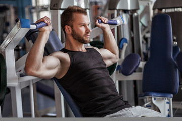 young man in sport gym club