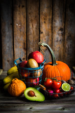 Fruits And Vegetables On Wooden Background