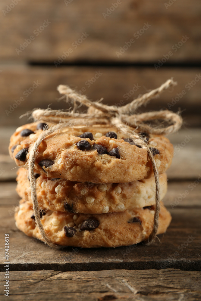 Tasty cookies on rustic wooden background