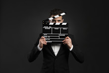 Business Man Holding A Clapboard