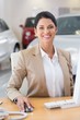 © WavebreakMediaMicro - Smiling businesswoman working in her desk