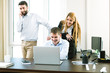 © photopitu - Young business people discuss the new project at office