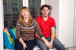 © Kekyalyaynen - Portrait of Caucasian man and woman sit on window sill together