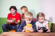 © Kekyalyaynen - Children and parents are passionate about games on phones, pads
