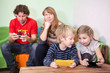 © Kekyalyaynen - Children and husband are passionate about games in cellphones