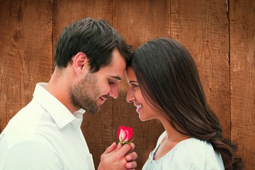 Poster - Composite image of handsome man offering his girlfriend a rose