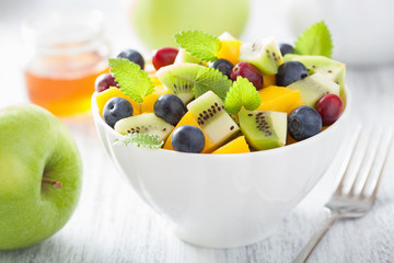 Wall Mural - fruit salad with mango kiwi blueberry for breakfast