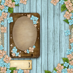 Sticker - Blue wooden background with a frame, flowers, pearls and lace