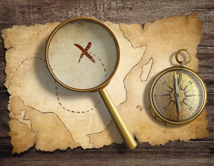 Poster - aged antique nautical compass and magnifying glass on table with