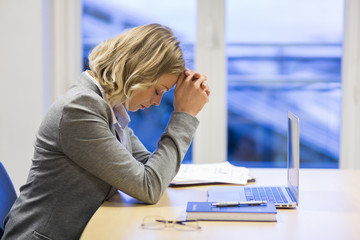 Stressed businesswoman in the office