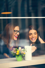 Wall Mural - Females In Cafe Using Technology