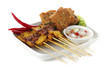 Grilled pork satay with sauce on plate