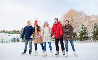 Poster - happy friends ice skating on rink outdoors