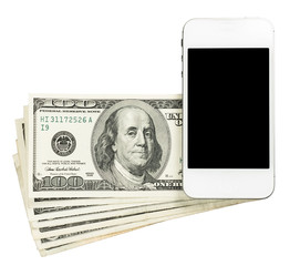 Smartphone lying on banknotes of United States, isolated on a wh