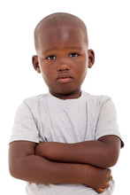 Unhappy Little African Boy With Arms Crossed