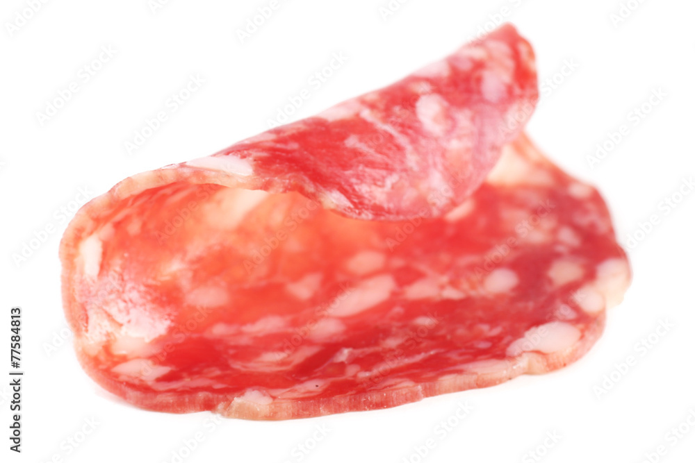 Slice of salami isolated on white background