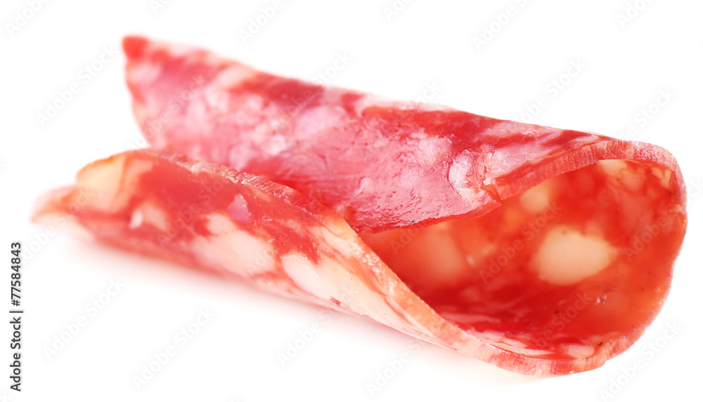 Slice of salami isolated on white background