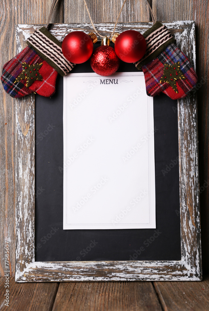 Menu board with Christmas decoration on wooden planks