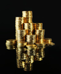 Poster - Pile of coins on dark background