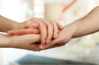 © Africa Studio - Male and female hands on light background