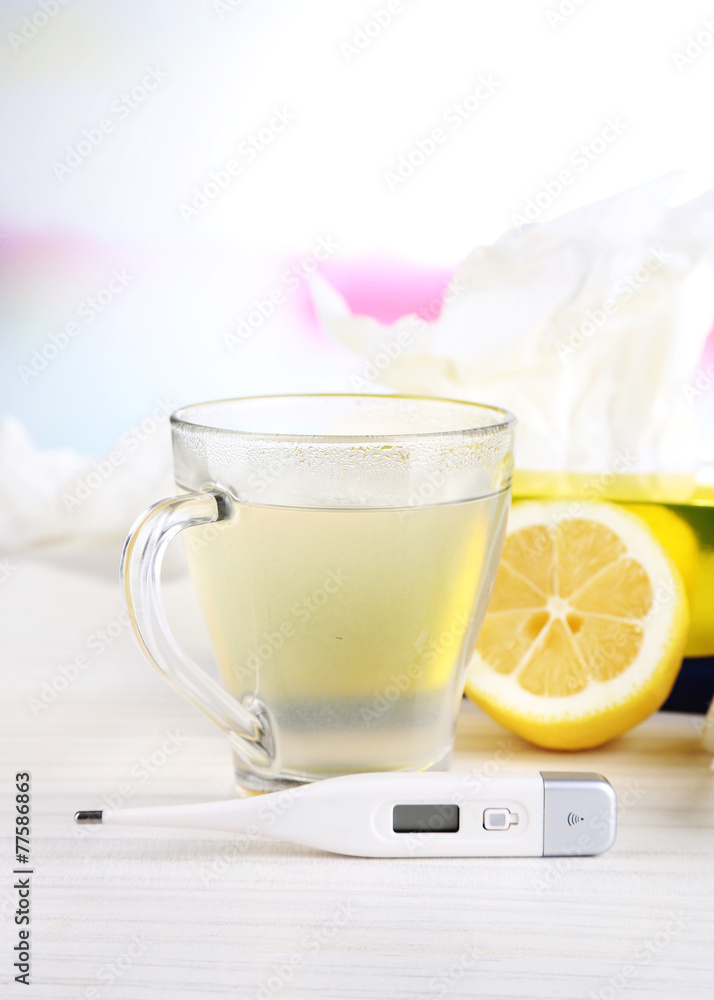 Hot tea for colds, pills and handkerchiefs