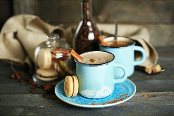 Beautiful composition with tasty cappuccino on wooden table