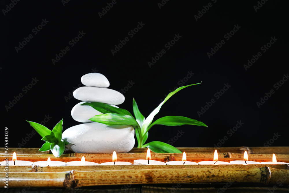 Beautiful composition with spa stones and candles