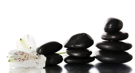 Spa stones with flower isolated on white