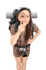 Poster - Female tourist looking through a magnifying glass