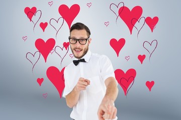 Poster - Composite image of geeky hipster pointing at camera